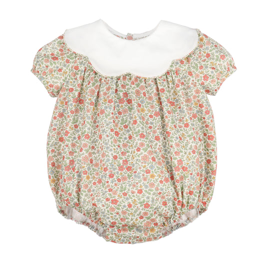 Floral baby romper with white collar on a white background