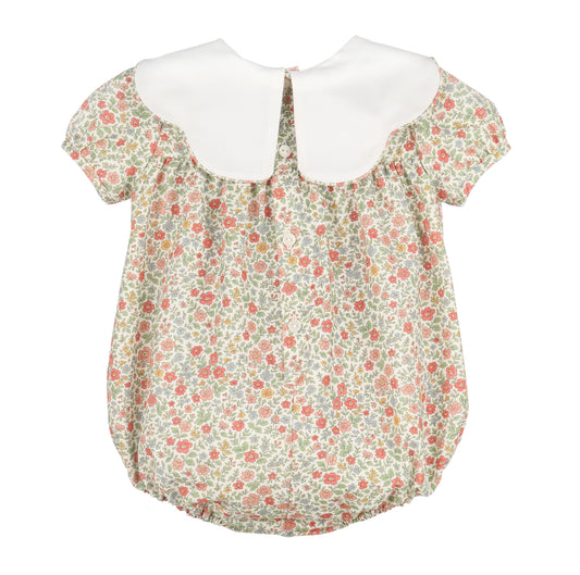 Floral baby romper with white collar on a white background