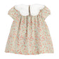 Floral dress with a white collar on a white background