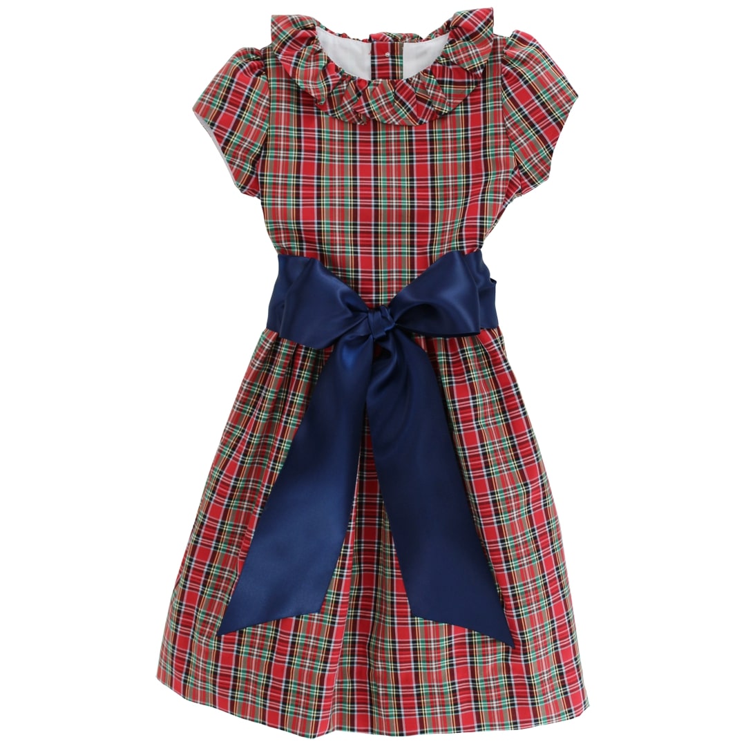 Red and green plaid dress with a large blue bow on a white background