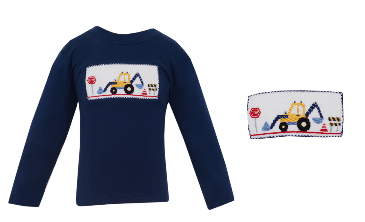 Navy blue long-sleeve shirt with construction vehicle design on a white background