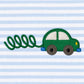Close-up of the green car appliqué with cream windows, grey wheels, blue bumpers and a looping green exhaust trail on light blue stripes